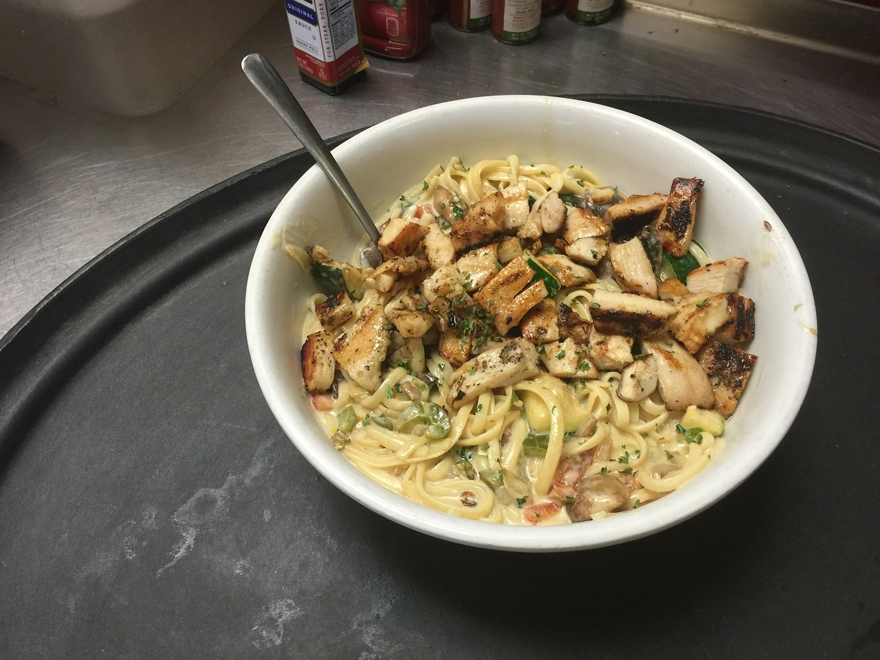 Chicken and Tomato Sauce With Basil and Pine Nuts on Pasta