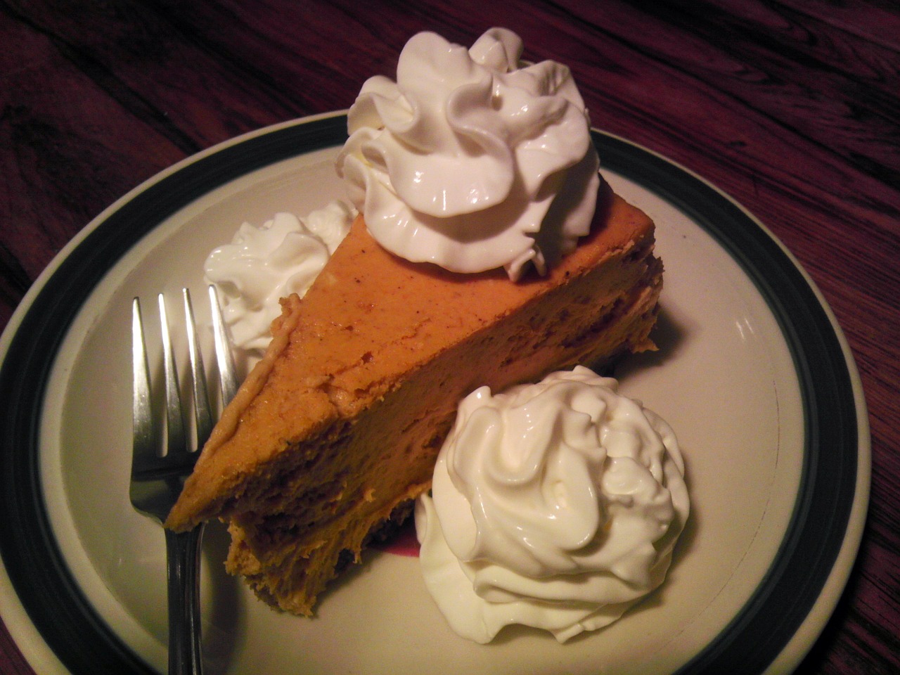 Pumpkin Cheesecake with Bourbon Spiked Cream