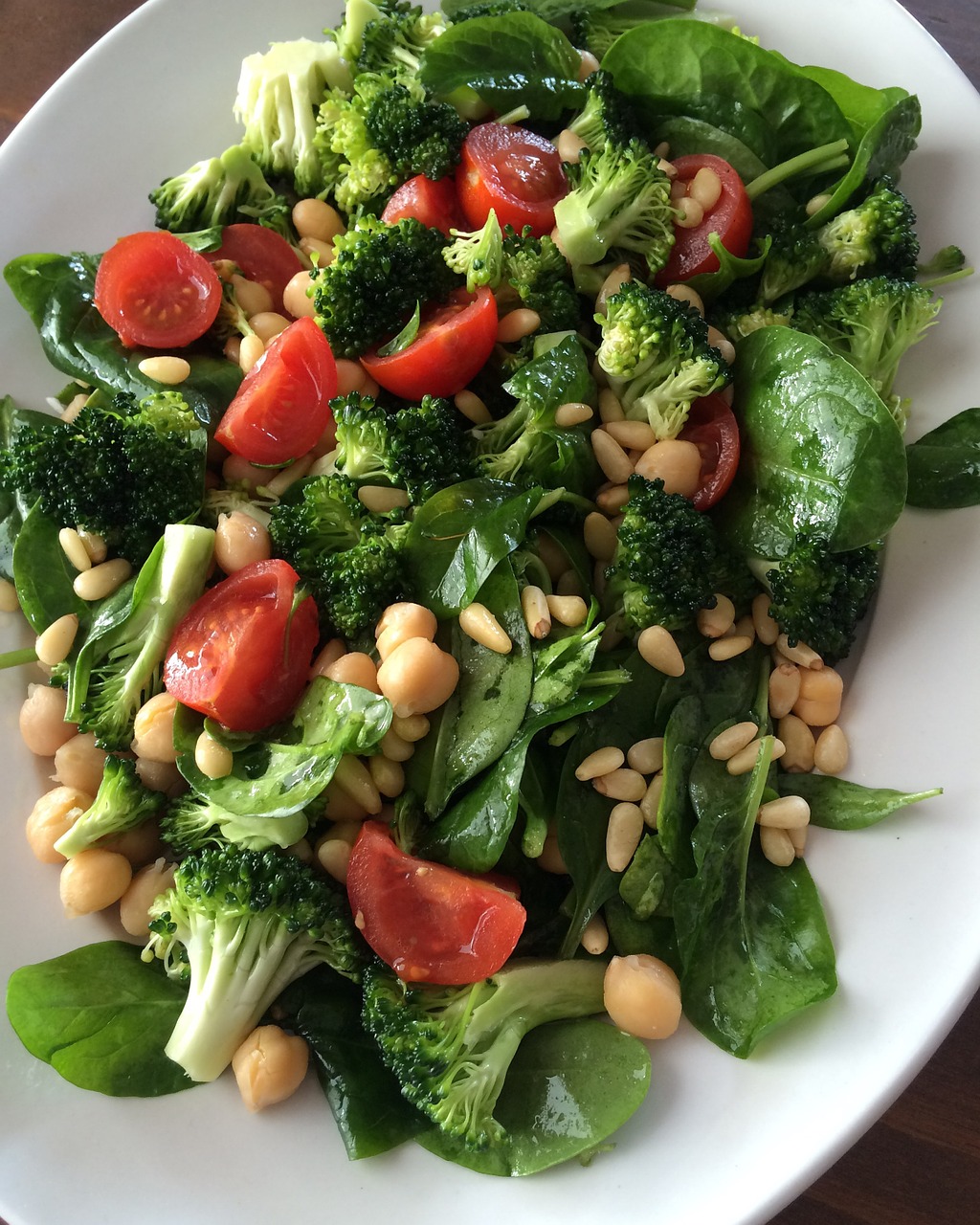 Sweet and sour broccoli stalks with pine nuts