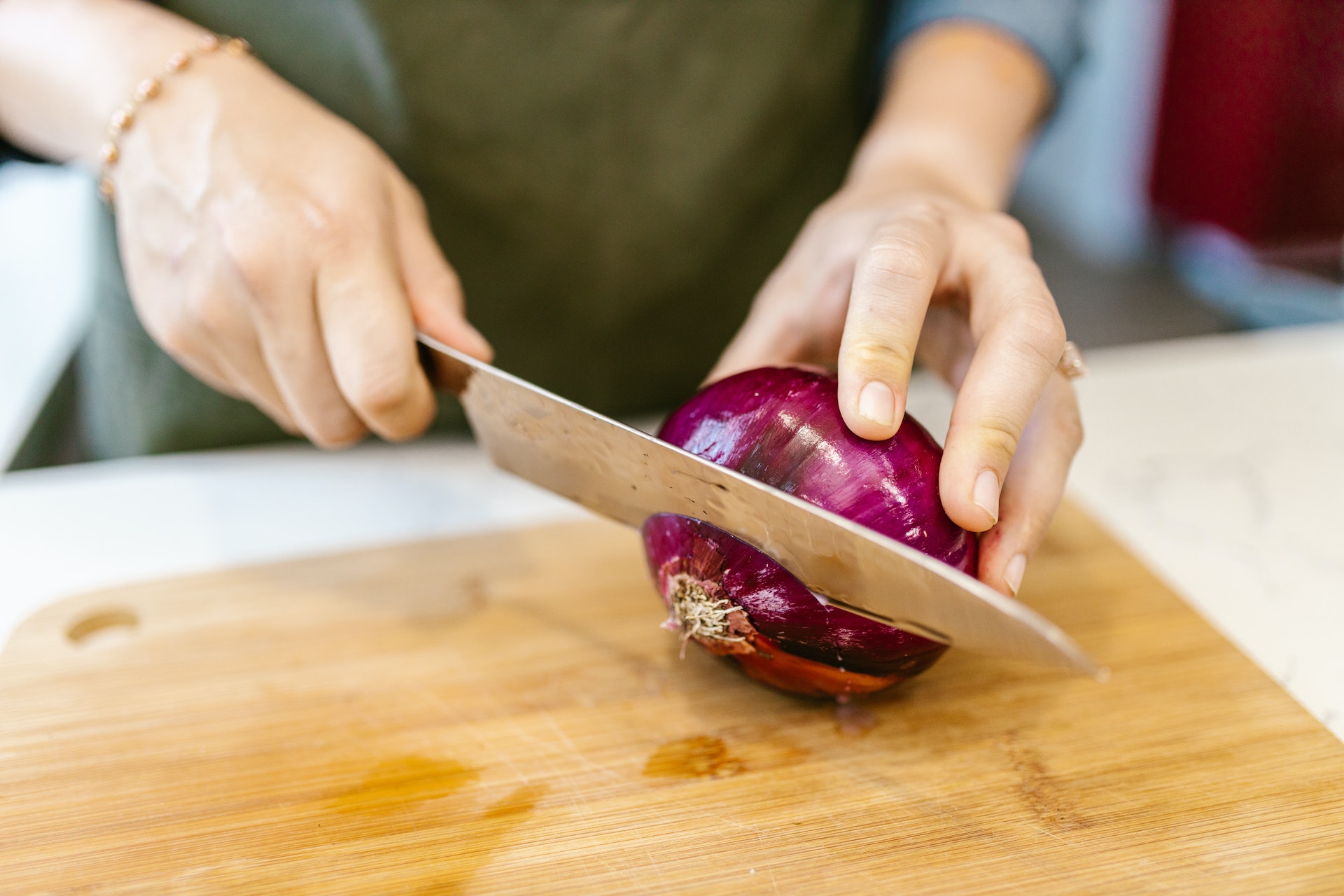 Never remove the onion root when cutting